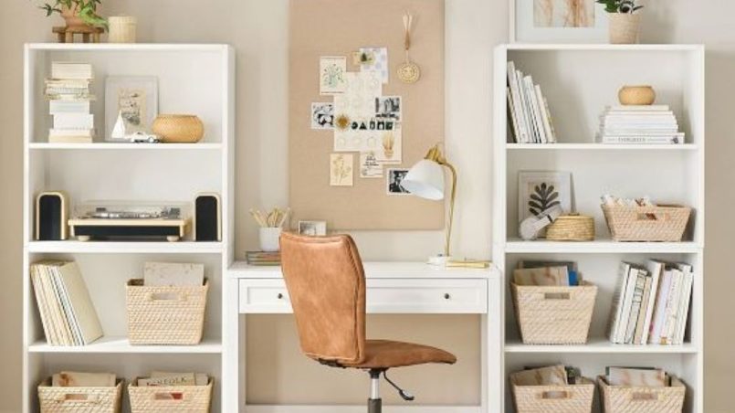Leather-lined bookshelf with measuring tape and calculation notes on wooden surface