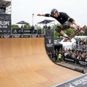 Pro skateboarder performing vert ramp trick at JACKALOPE Montreal 2026