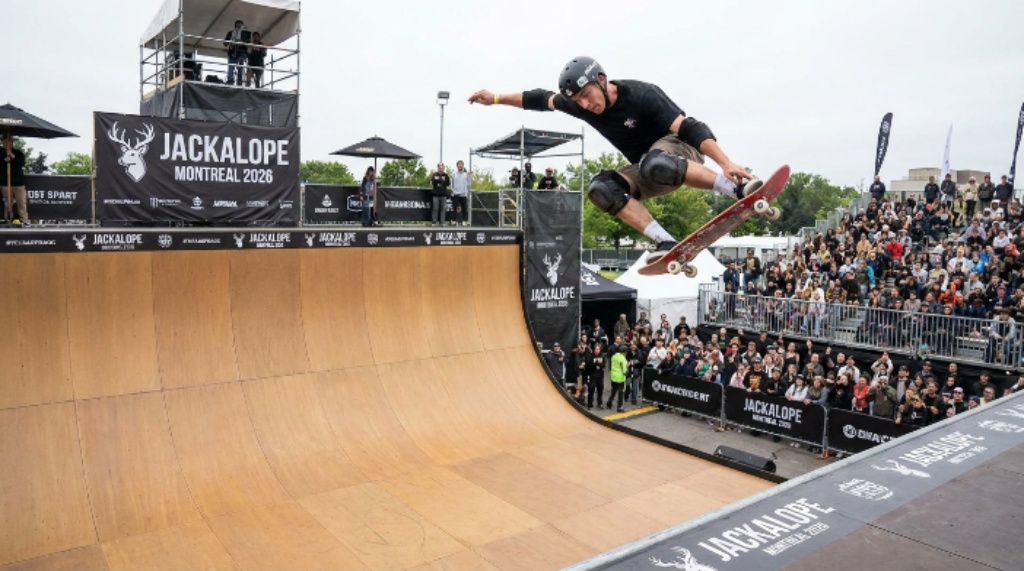 Pro skateboarder performing vert ramp trick at JACKALOPE Montreal 2026