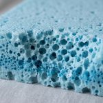 Close-up of breathable gel-infused memory foam mattress topper material.