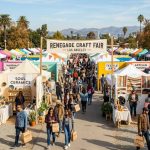 Outdoor rows of handmade craft vendor booths at the Renegade Craft Fair in Los Angeles on a sunny November day