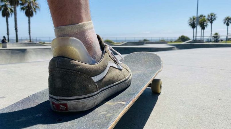 Skateboarder landing safely at a San Diego skate park